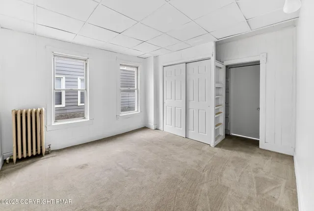 an empty room with windows