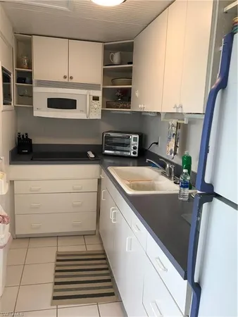 a view of a kitchen with a sink and dishwasher