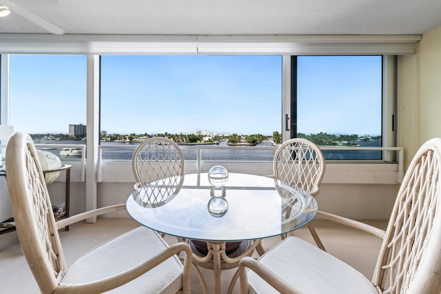 215 North Birch Road, Unit 4C Fort Lauderdale, FL 33304 - Photo 11 of 32 a view of a dining room with furniture window and wooden floor