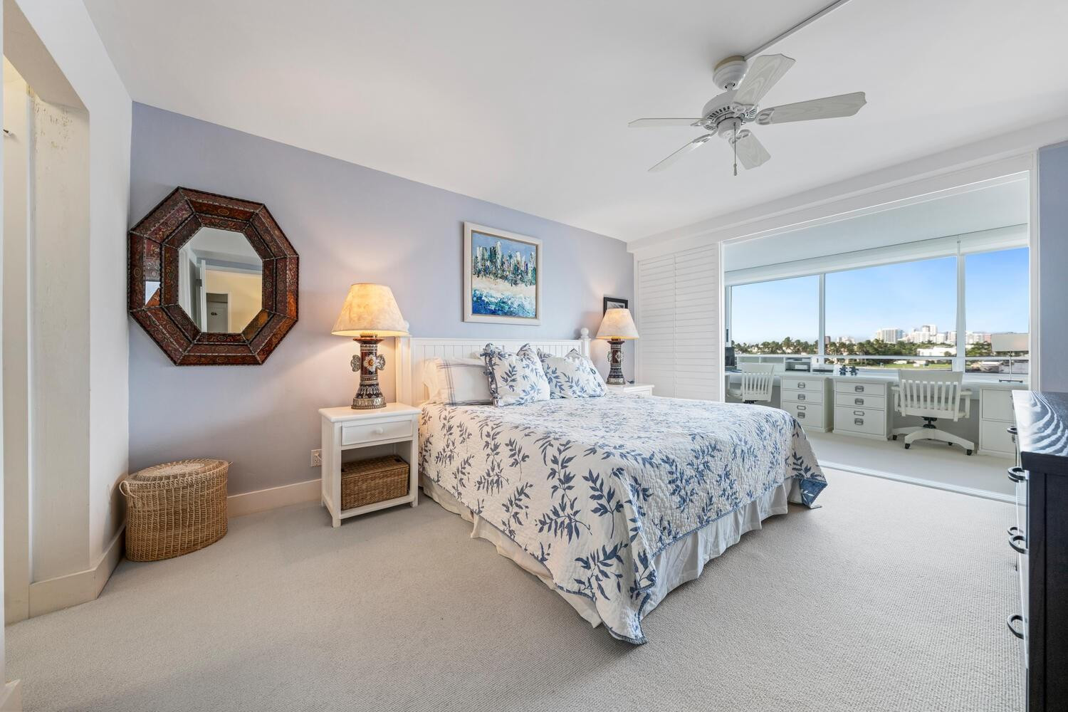 215 North Birch Road, Unit 4C Fort Lauderdale, FL 33304 - Photo 19 of 32 a spacious bedroom with a bed and a chandelier