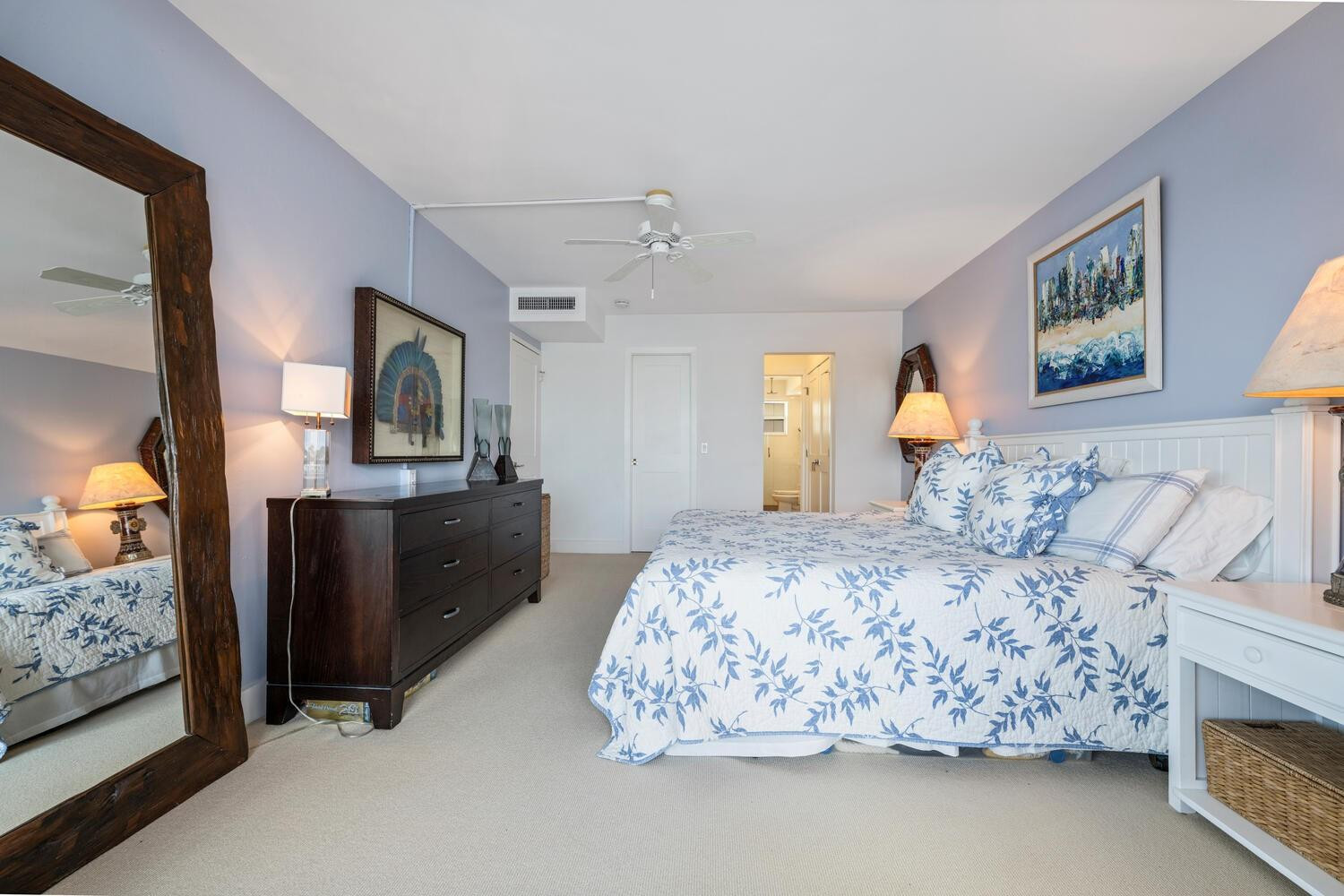 215 North Birch Road, Unit 4C Fort Lauderdale, FL 33304 - Photo 20 of 32 a bedroom with a bed and dresser with mirror