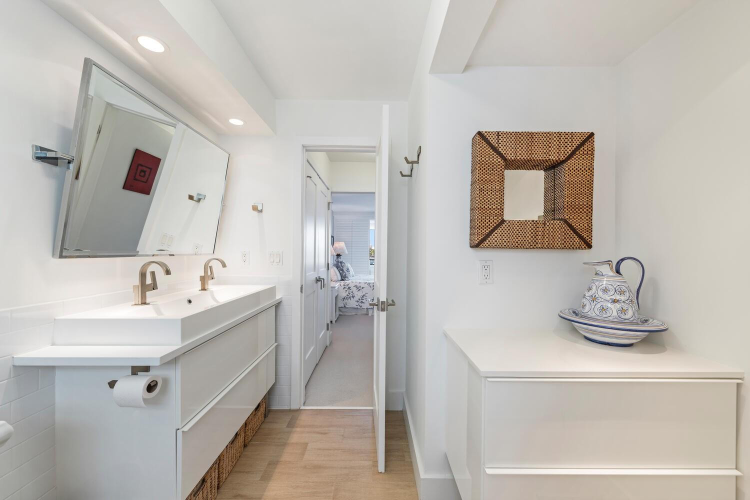 215 North Birch Road, Unit 4C Fort Lauderdale, FL 33304 - Photo 24 of 32 a bathroom with a sink and a mirror