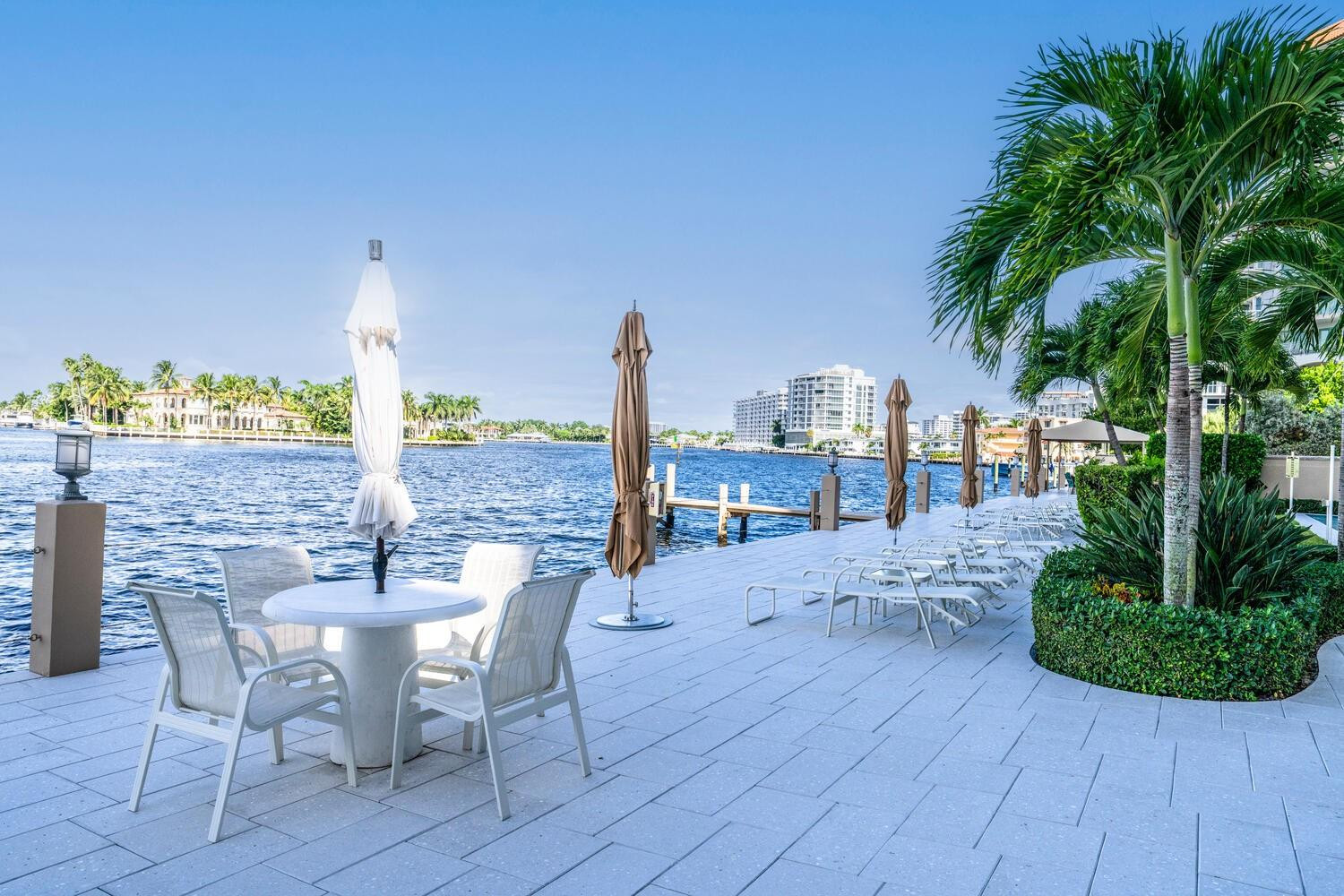 215 North Birch Road, Unit 4C Fort Lauderdale, FL 33304 - Photo 29 of 32 a view of a patio with a table and chairs and potted plants