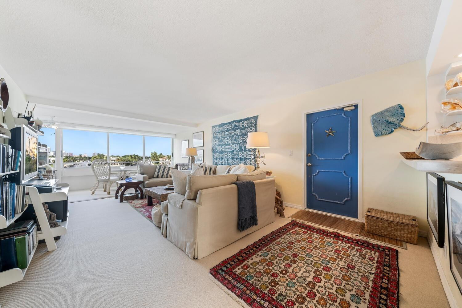 215 North Birch Road, Unit 4C Fort Lauderdale, FL 33304 - Photo 5 of 32 a living room with furniture and a rug