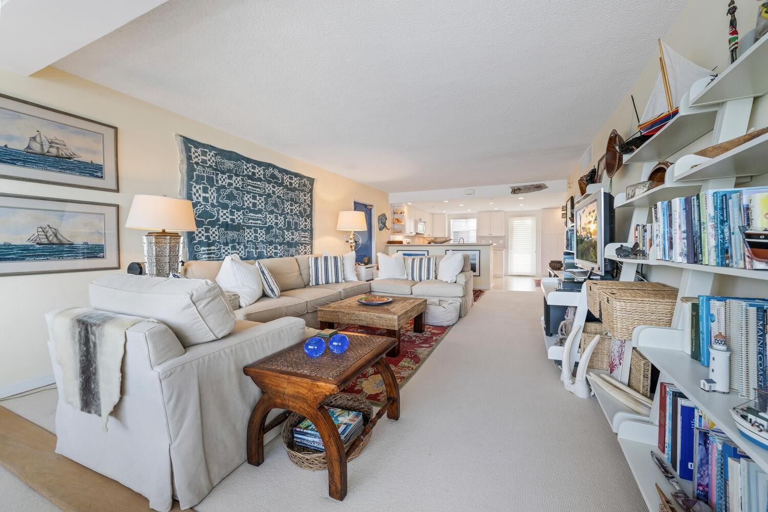 215 North Birch Road, Unit 4C Fort Lauderdale, FL 33304 - Photo 9 of 32 a living room with furniture and a book shelf