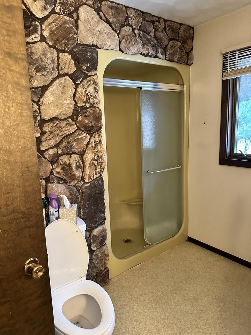 2191 Harvey Road Albany, IL 61230 - Photo 14 of 52 a bathroom with a toilet and a shower