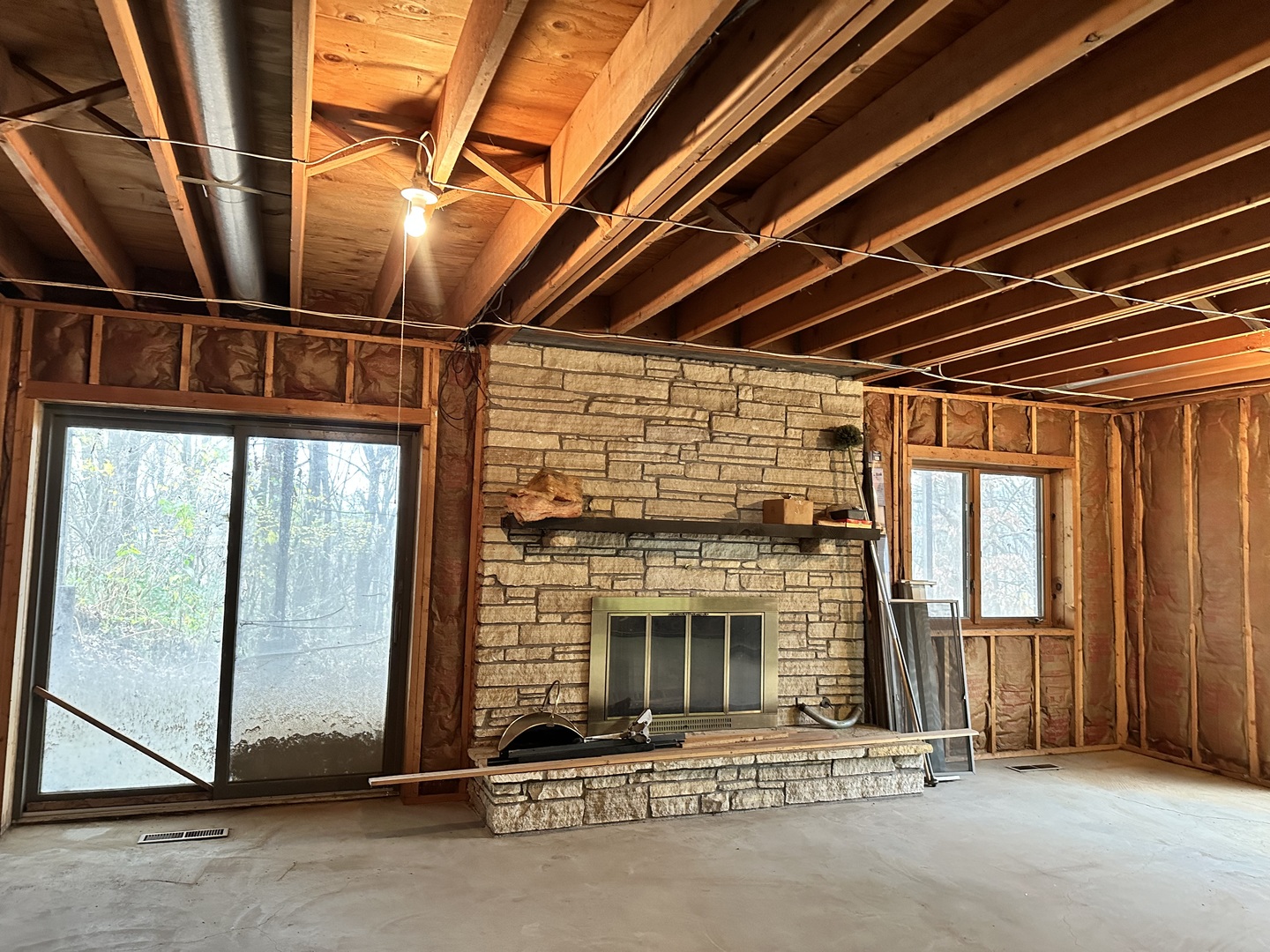 2191 Harvey Road Albany, IL 61230 - Photo 23 of 52 a view of an empty room with wooden floor and a window