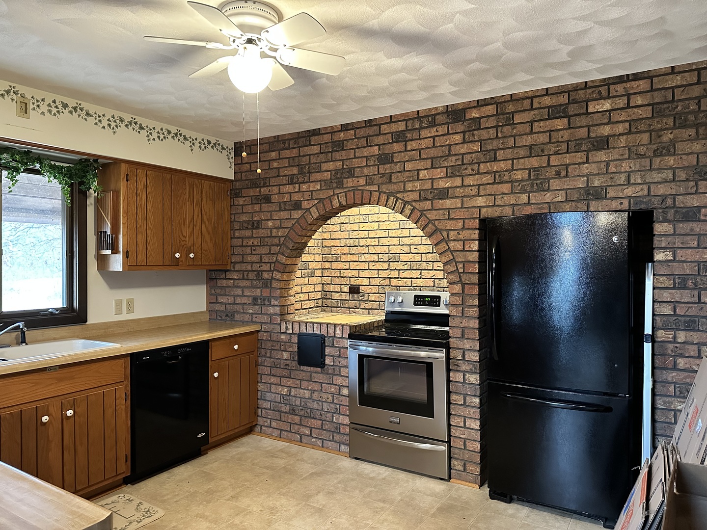 2191 Harvey Road Albany, IL 61230 - Photo 4 of 52 a kitchen with a refrigerator and a sink