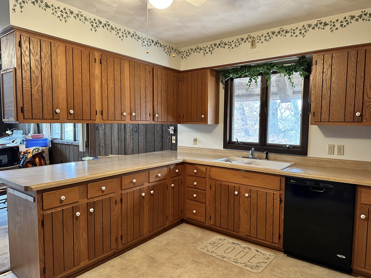 2191 Harvey Road Albany, IL 61230 - Photo 5 of 52 a kitchen with wooden cabinets and sink