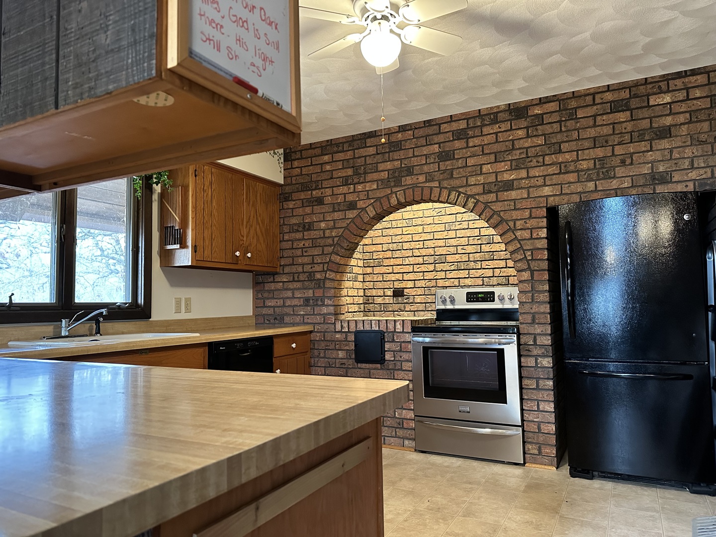 2191 Harvey Road Albany, IL 61230 - Photo 6 of 52 a kitchen with stainless steel appliances granite countertop a stove a sink and a refrigerator