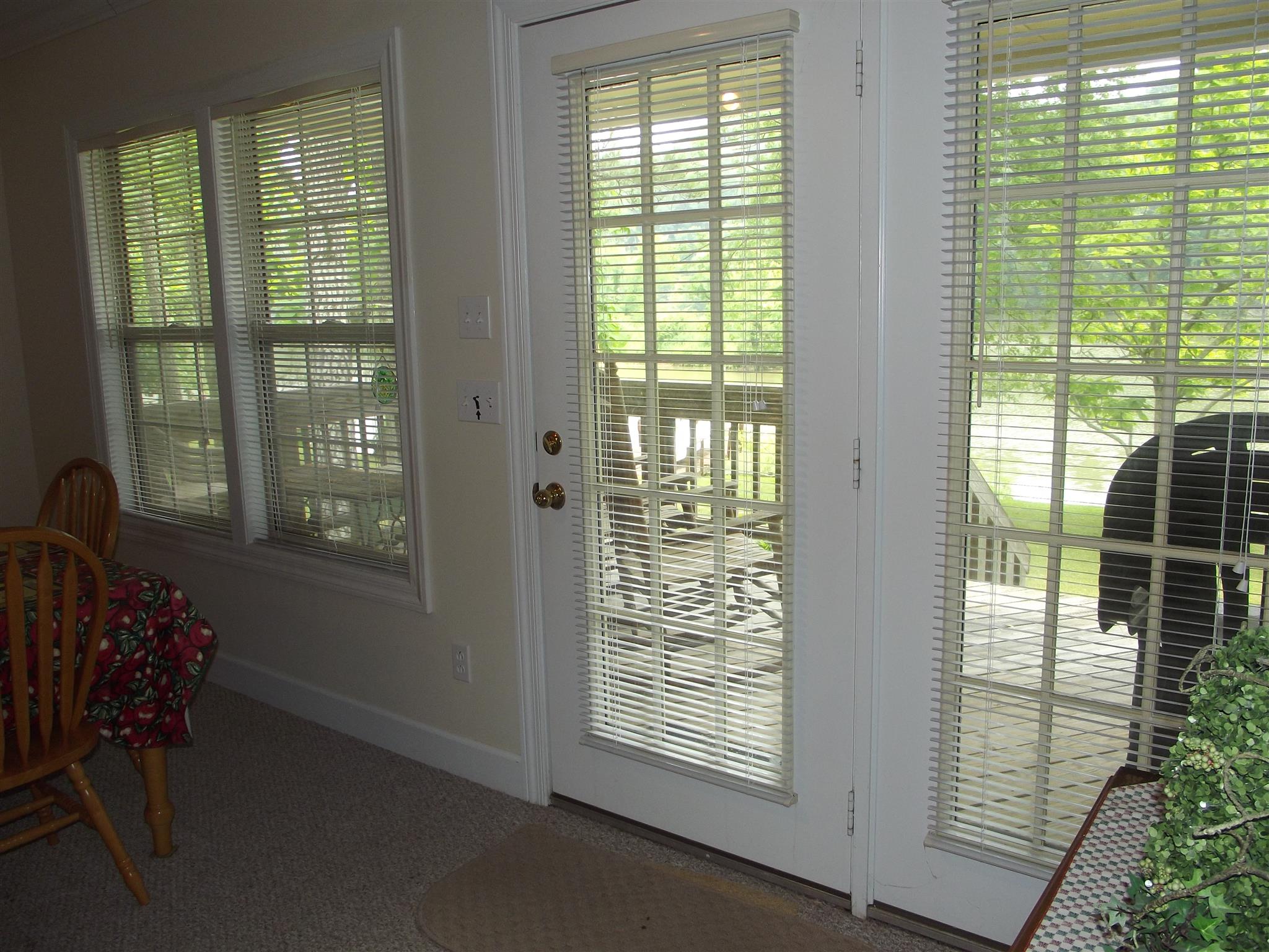 40 Lincoln Lake Road Kelso, TN 37348 - Photo 9 of 20 Plenty Of Windows letting in the Natural Light. Door Leads Out To Covered Porch.
