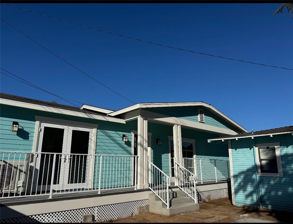 1319 Amapola Avenue Torrance, CA 90501 - Photo 1 of 17 a front view of a house with glass windows