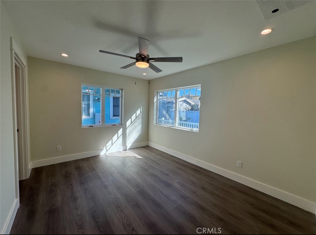 1319 Amapola Avenue Torrance, CA 90501 - Photo 5 of 17 a view of an empty room with wooden floor and a window