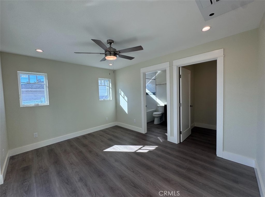 1319 Amapola Avenue Torrance, CA 90501 - Photo 8 of 17 an empty room with wooden floor and a ceiling fan
