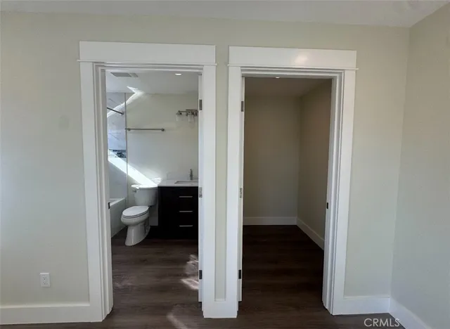 a view of a livingroom from a hallway