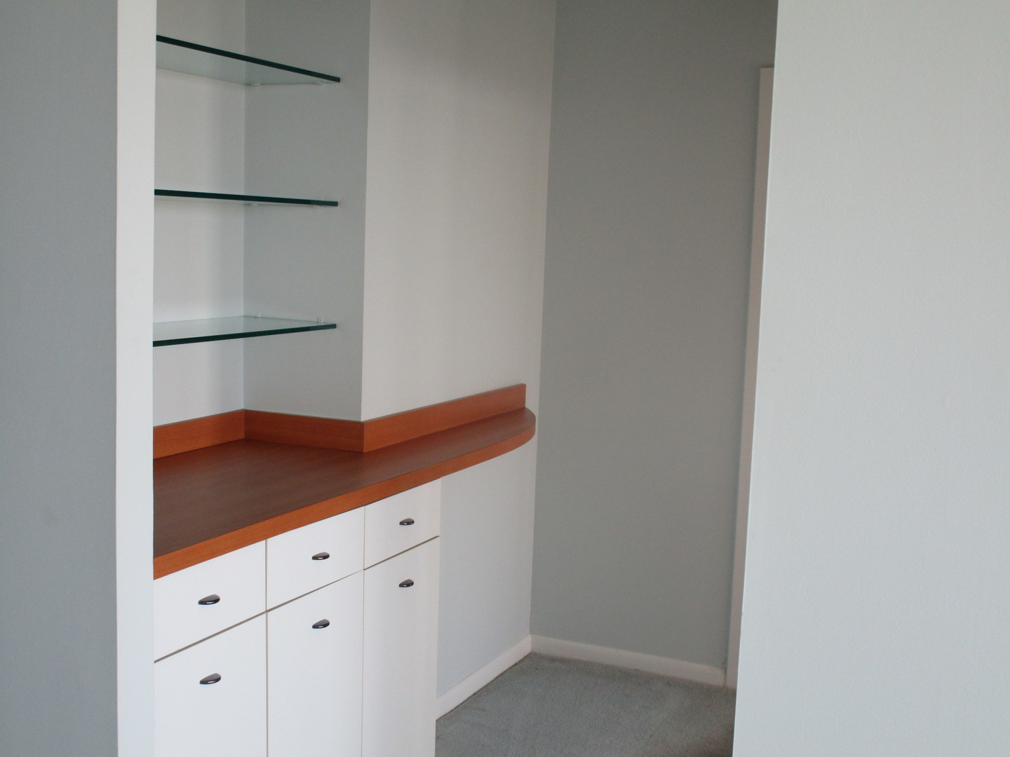 5445 North Sheridan Road, Unit 3311 Chicago, IL 60640 - Photo 13 of 15 a kitchen with white cabinets and a refrigerator