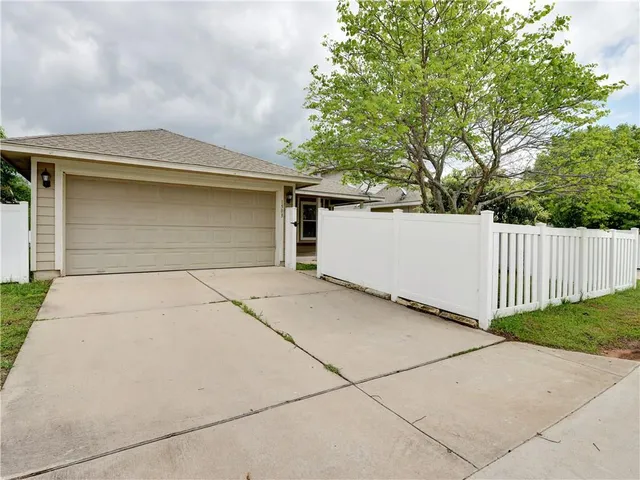 a front view of a house with garage