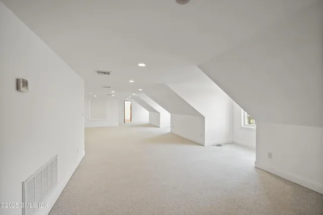 a view of empty room with windows