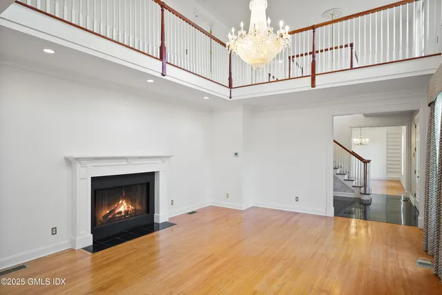a view of an empty room and fire place