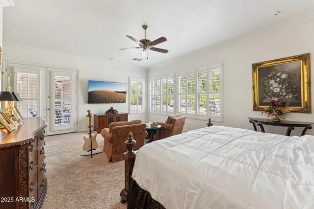 a living room with furniture ceiling fan and a rug
