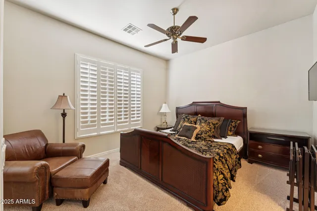 a bed room with a bed and a window