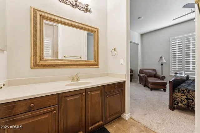 a bathroom with a sink a mirror and a bathtub