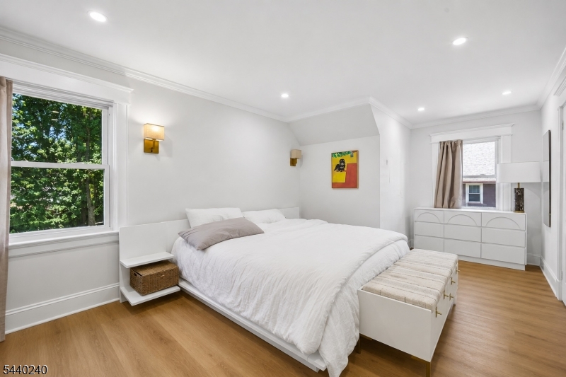 10 Mountain Place Montclair, NJ 07043 - Photo 9 of 21 a bedroom with a bed and wooden floor