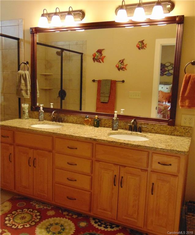 2010 Marina Pointe Road, Unit 2010 Salisbury, NC 28146 - Photo 15 of 28 a bathroom with a sink and a mirror