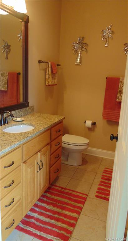 2010 Marina Pointe Road, Unit 2010 Salisbury, NC 28146 - Photo 19 of 28 a bathroom with a sink and mirror