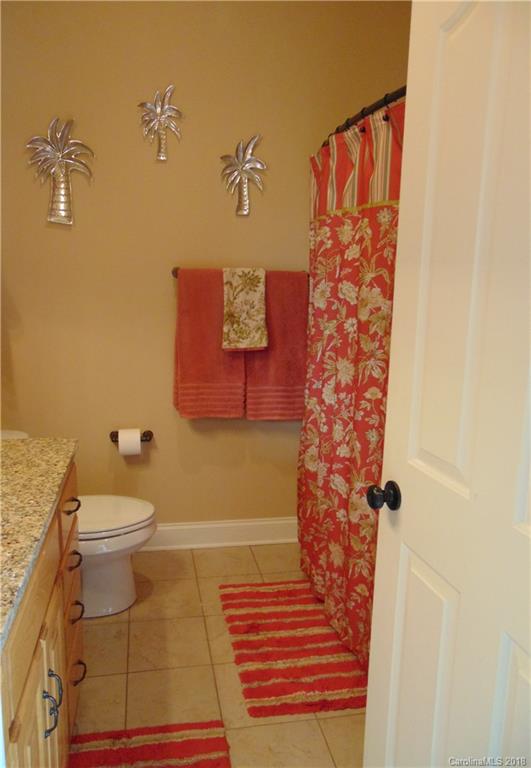 2010 Marina Pointe Road, Unit 2010 Salisbury, NC 28146 - Photo 20 of 28 a bathroom with a toilet and a shower curtain