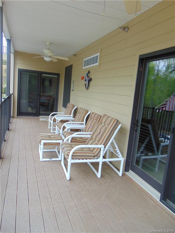 2010 Marina Pointe Road, Unit 2010 Salisbury, NC 28146 - Photo 23 of 28 a view of a chairs with a table and chairs in porch