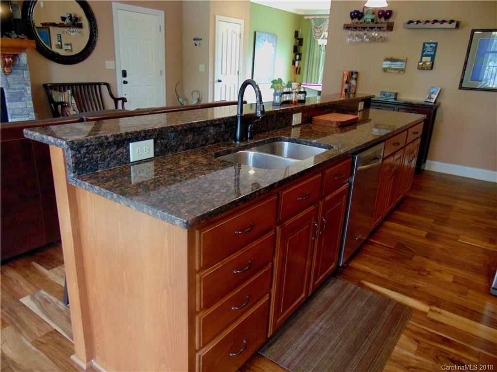 2010 Marina Pointe Road, Unit 2010 Salisbury, NC 28146 - Photo 8 of 28 a kitchen with stainless steel appliances granite countertop a sink and a wooden floors