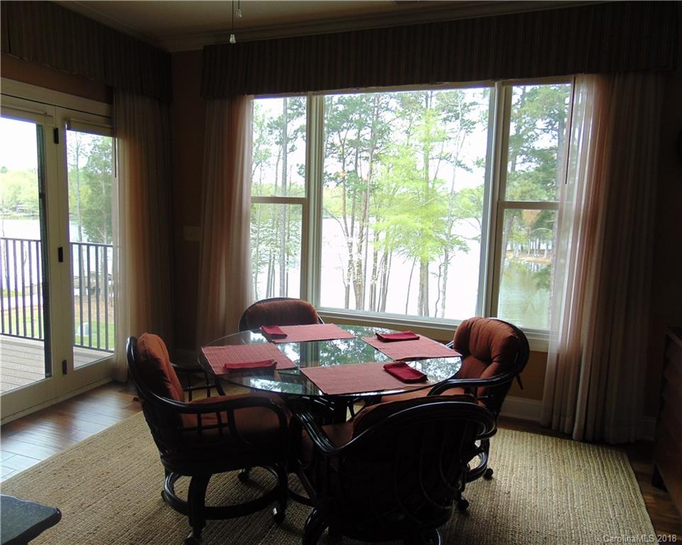 2010 Marina Pointe Road, Unit 2010 Salisbury, NC 28146 - Photo 10 of 28 a dining room with furniture and wooden floor