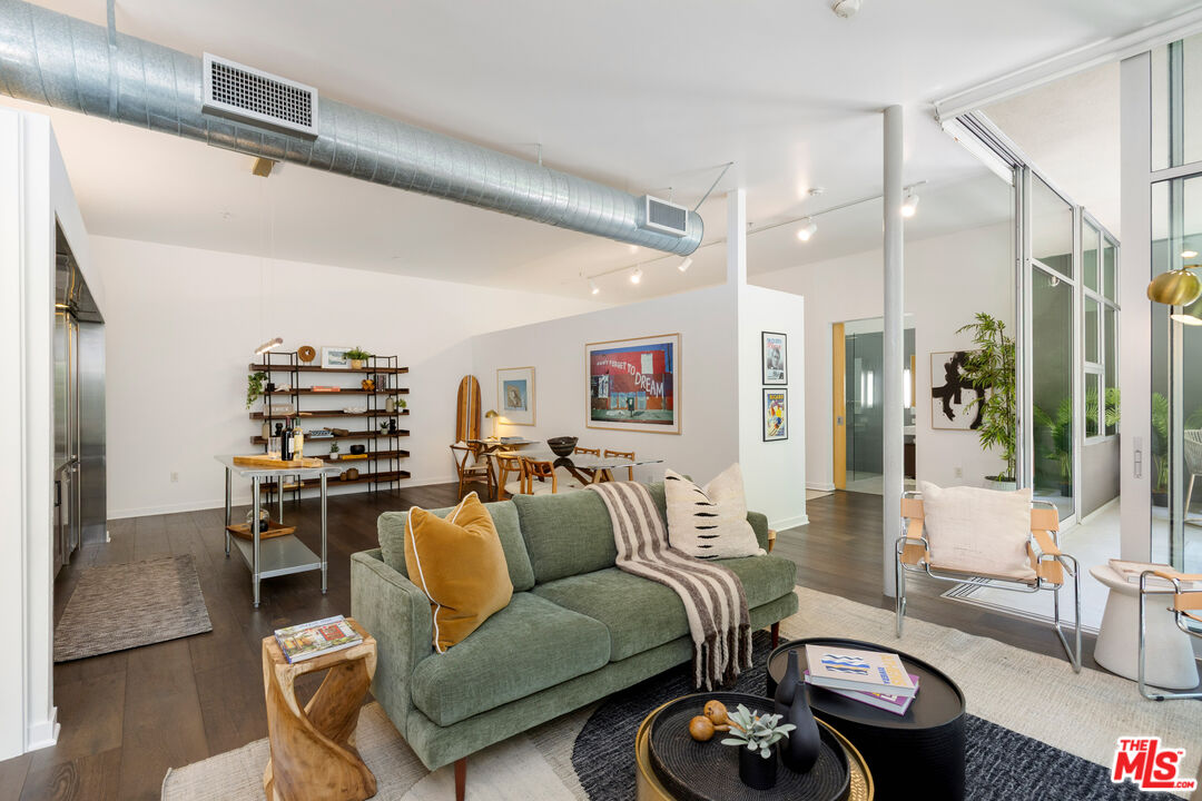 4080 Glencoe Avenue, Unit 104 Marina del Rey, CA 90292 - Photo 10 of 30 a living room with furniture a rug and white walls