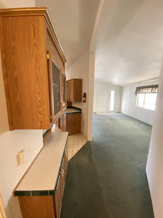 a spacious bathroom with a granite countertop sink and a mirror