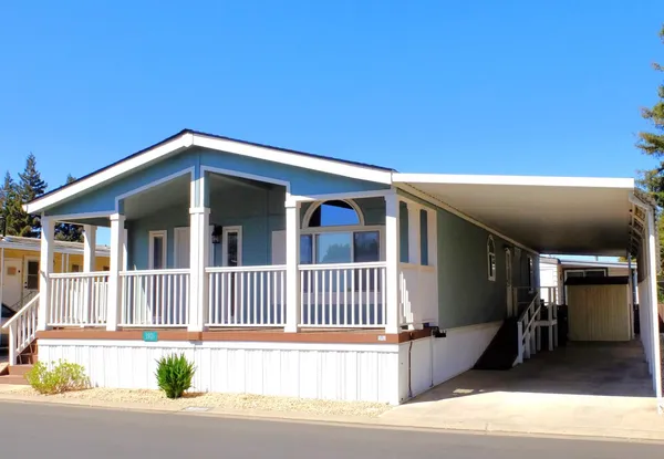 a front view of a house with garage