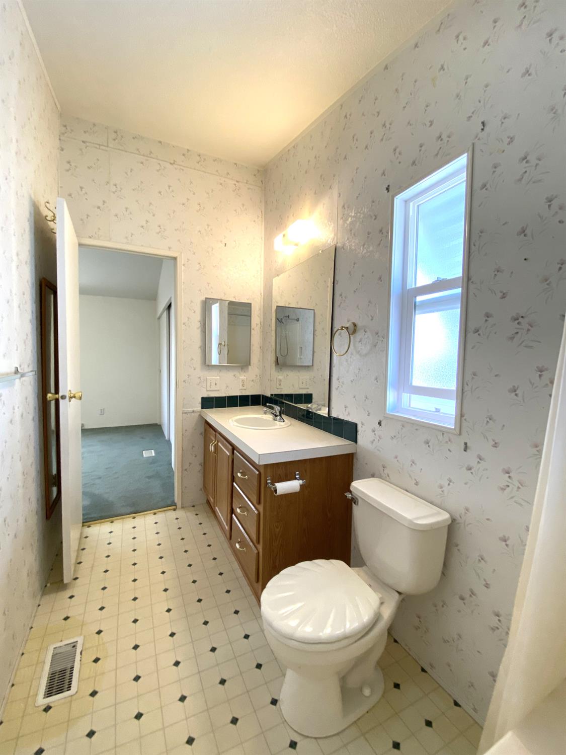 3901 Maui Terrace Modesto, CA 95355 - Photo 22 of 32 a bathroom with a sink toilet vanity and shower