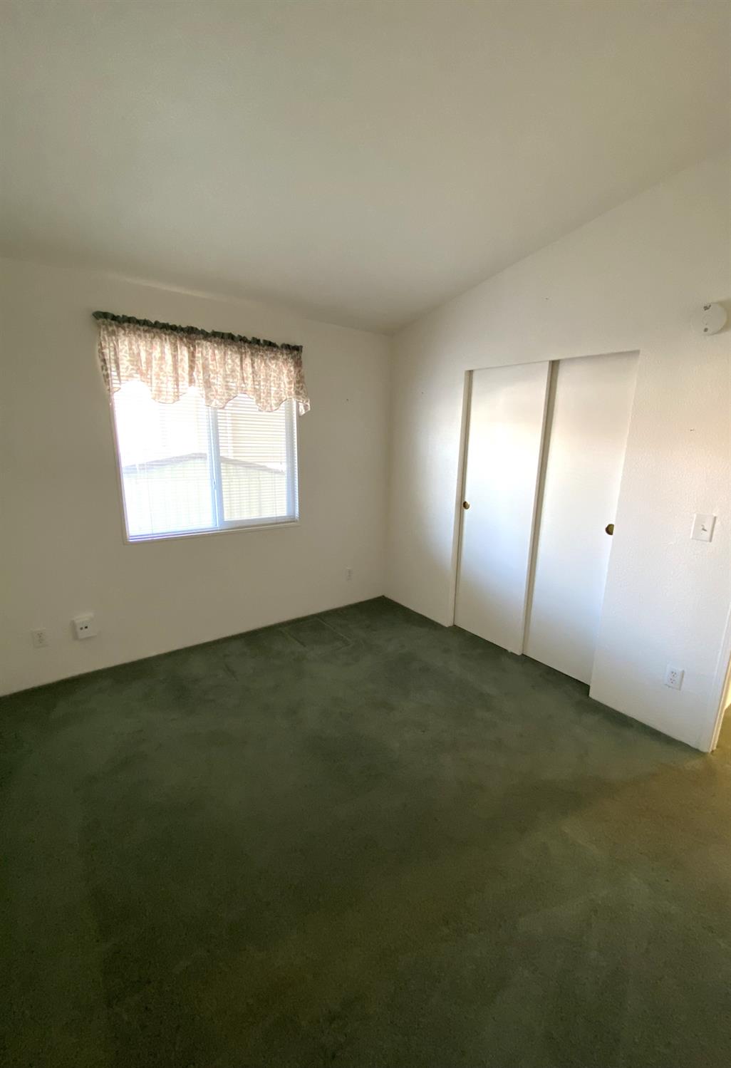 3901 Maui Terrace Modesto, CA 95355 - Photo 23 of 32 an empty room with a empty space and a window