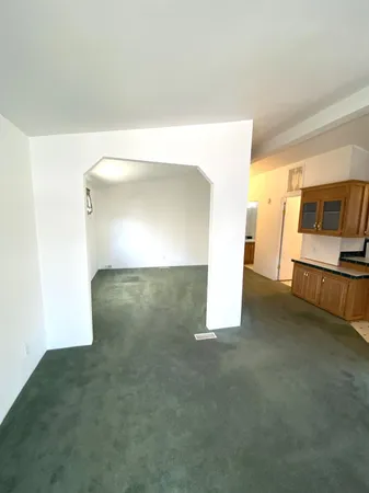 a view of a big room with closet and wooden floor