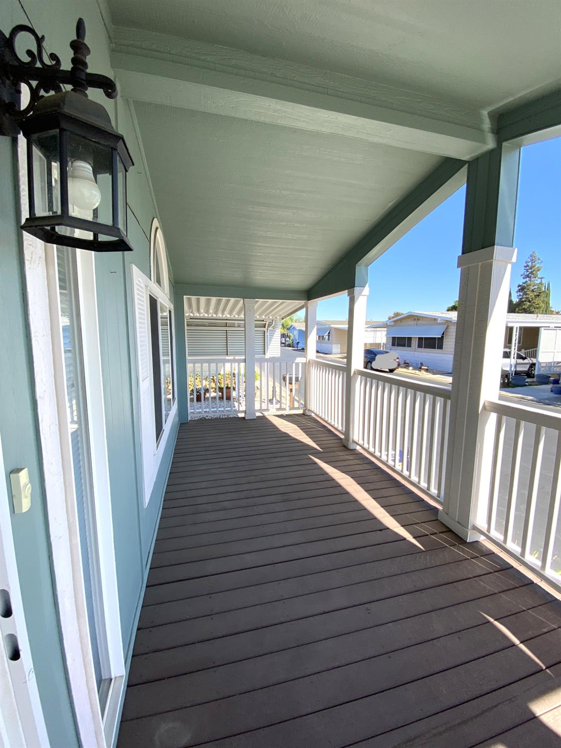 3901 Maui Terrace Modesto, CA 95355 - Photo 7 of 32 a view of a hallway with wooden floor and staircase