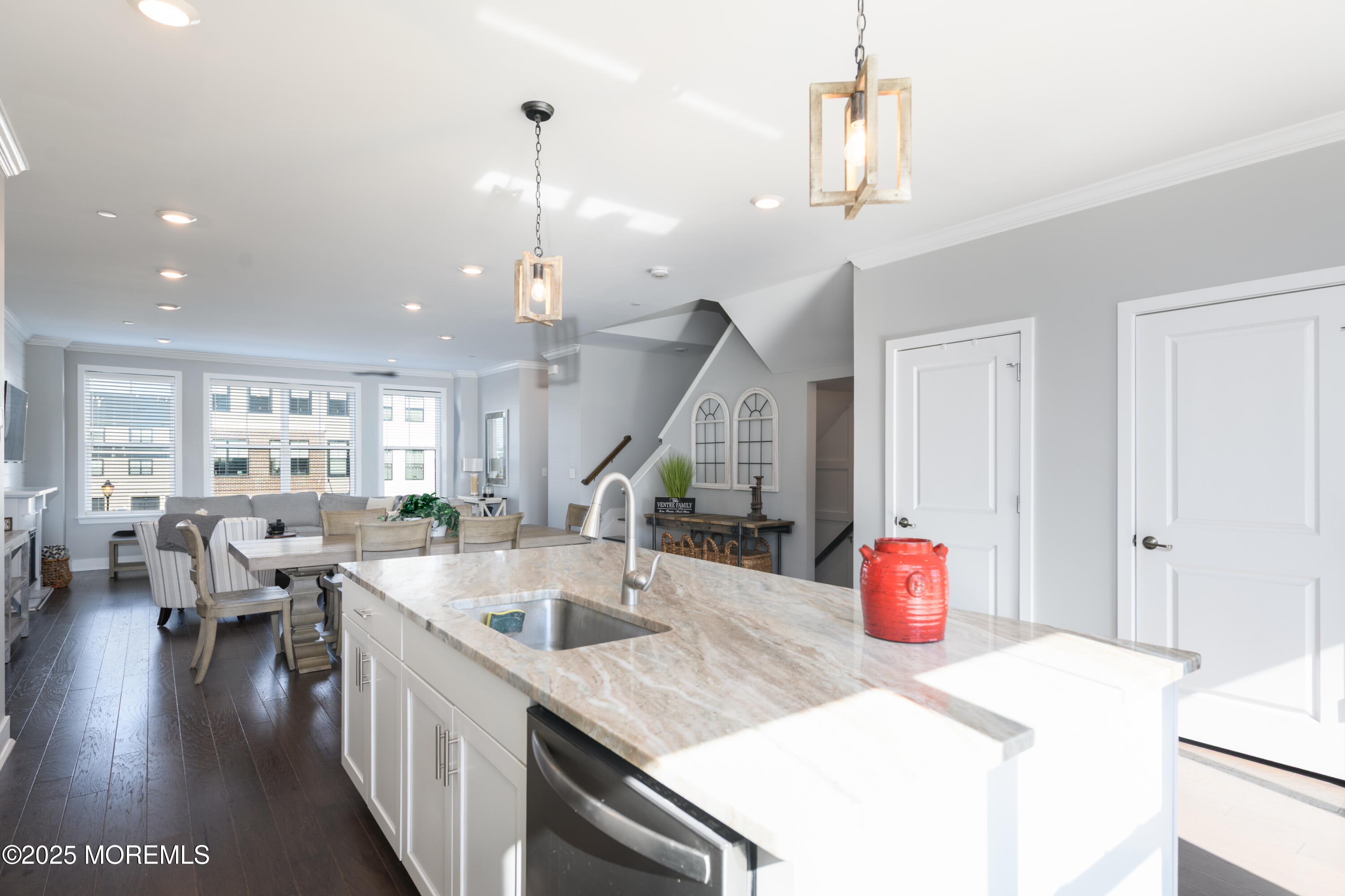 26 Kelly Way Tinton Falls, NJ 07724 - Photo 11 of 33 a kitchen with stainless steel appliances granite countertop a sink dishwasher and a dining table with wooden floor