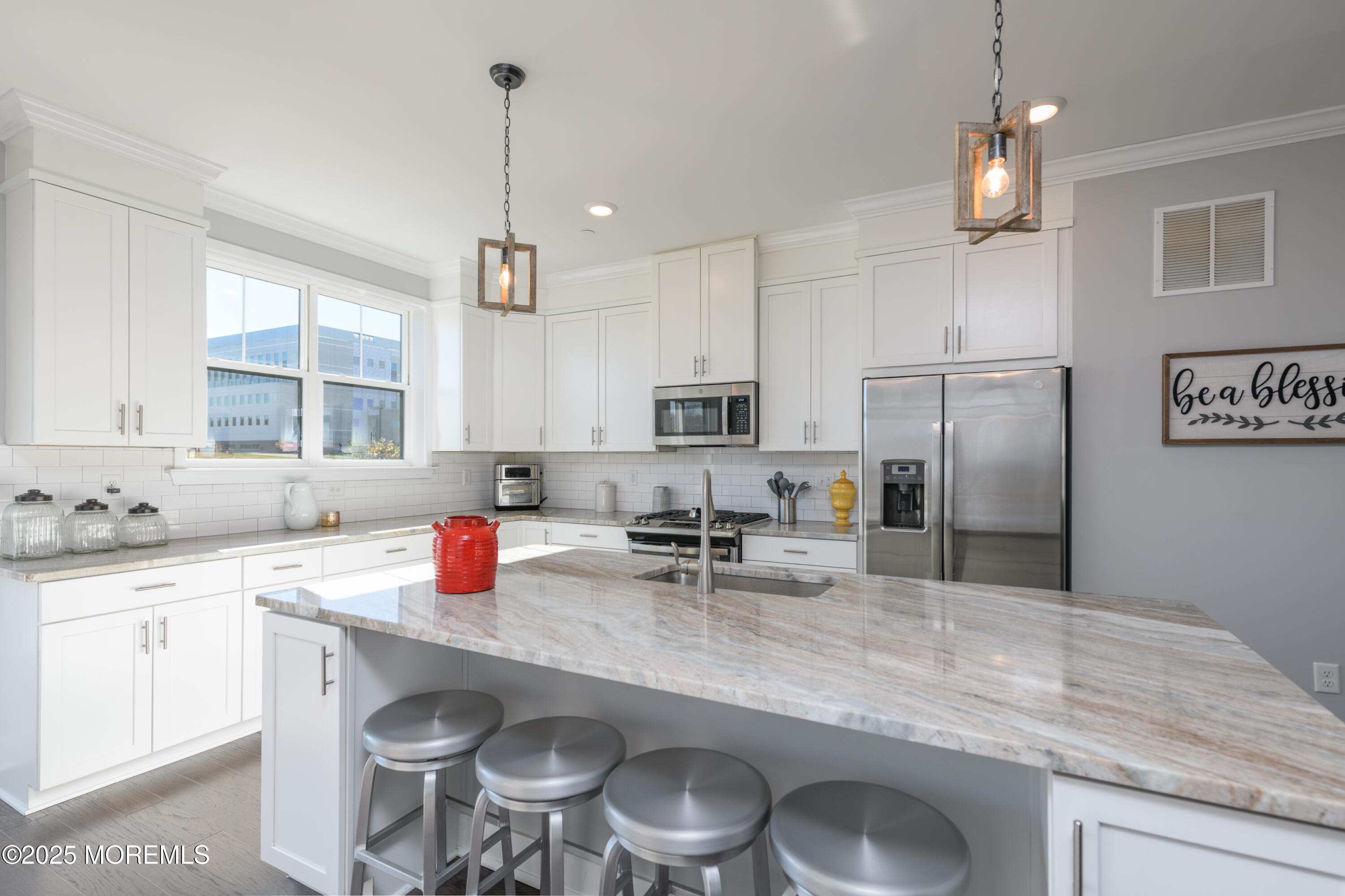 26 Kelly Way Tinton Falls, NJ 07724 - Photo 12 of 33 a kitchen with stainless steel appliances granite countertop a sink stove and refrigerator