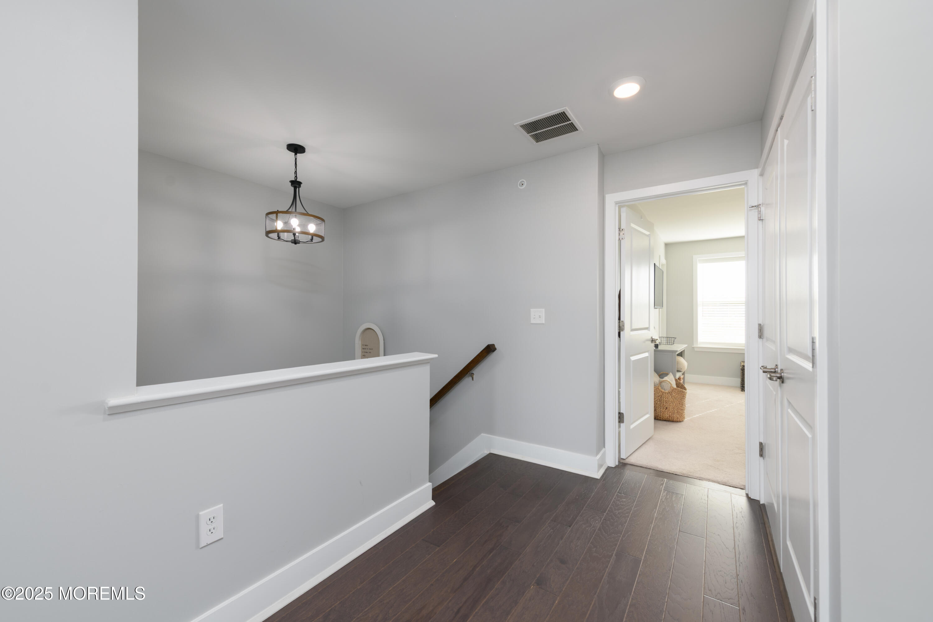 26 Kelly Way Tinton Falls, NJ 07724 - Photo 15 of 33 wooden floor in an empty room with a window