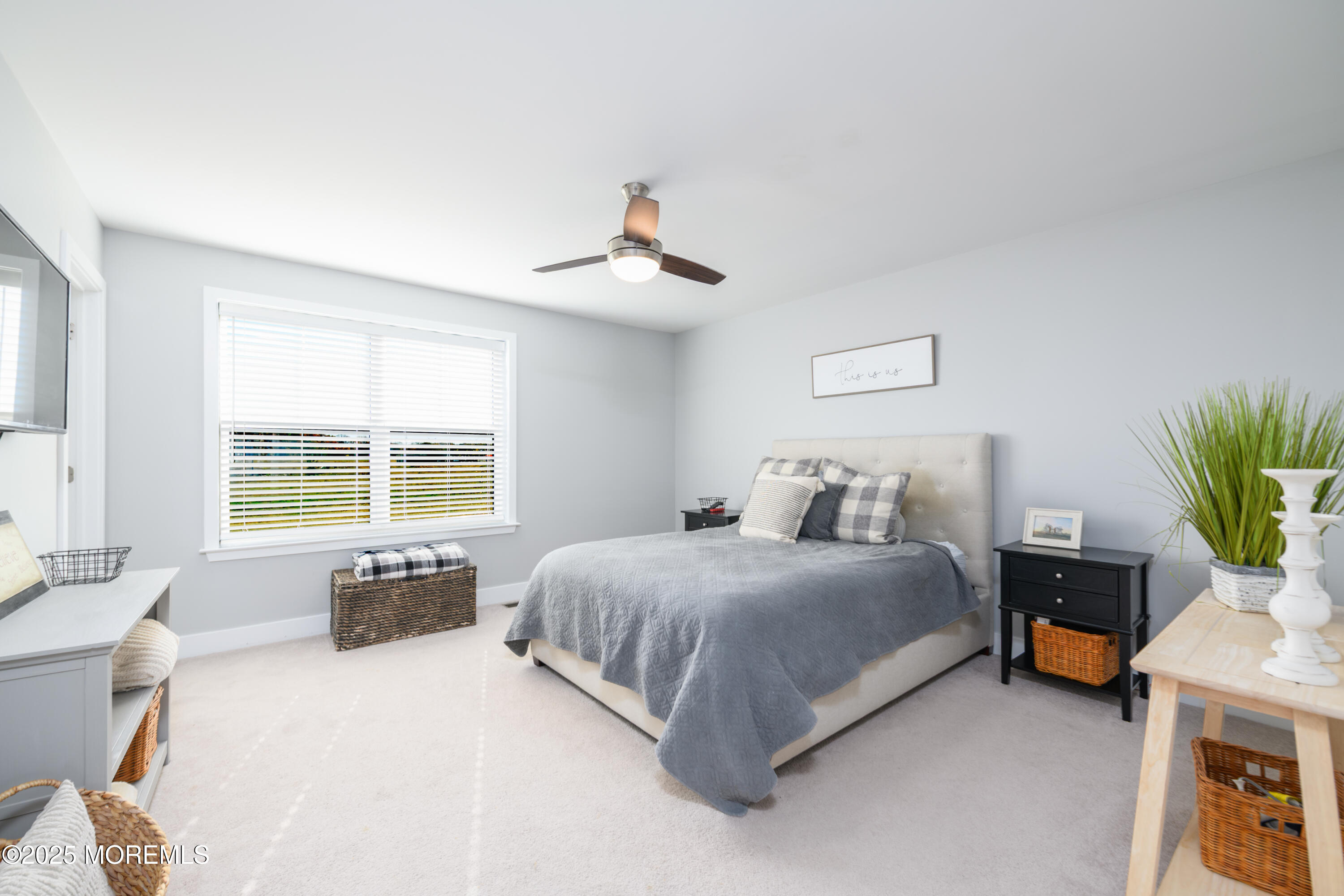 26 Kelly Way Tinton Falls, NJ 07724 - Photo 16 of 33 a spacious bedroom with a bed and a couch