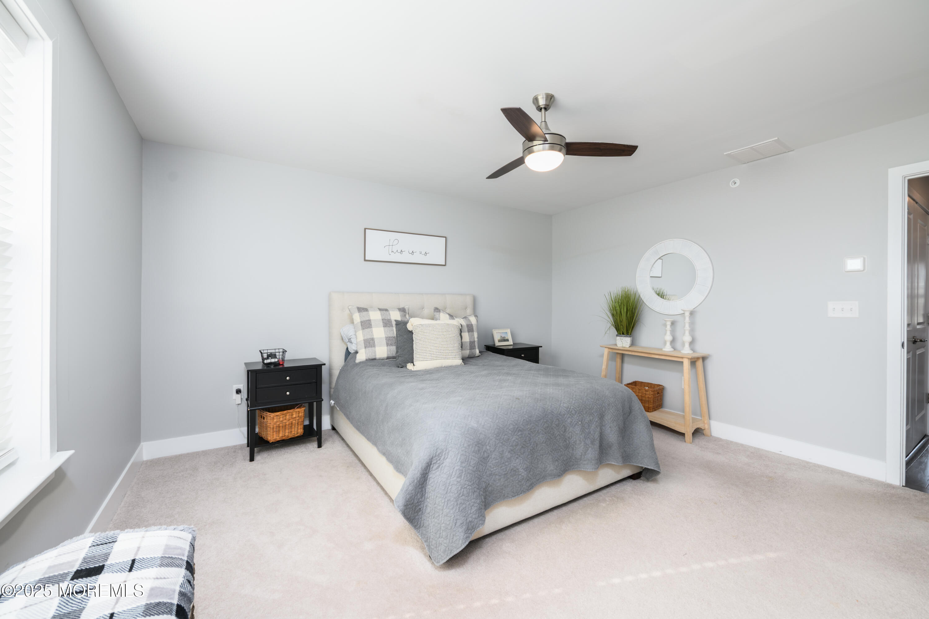 26 Kelly Way Tinton Falls, NJ 07724 - Photo 17 of 33 a bedroom with a bed and a chandelier