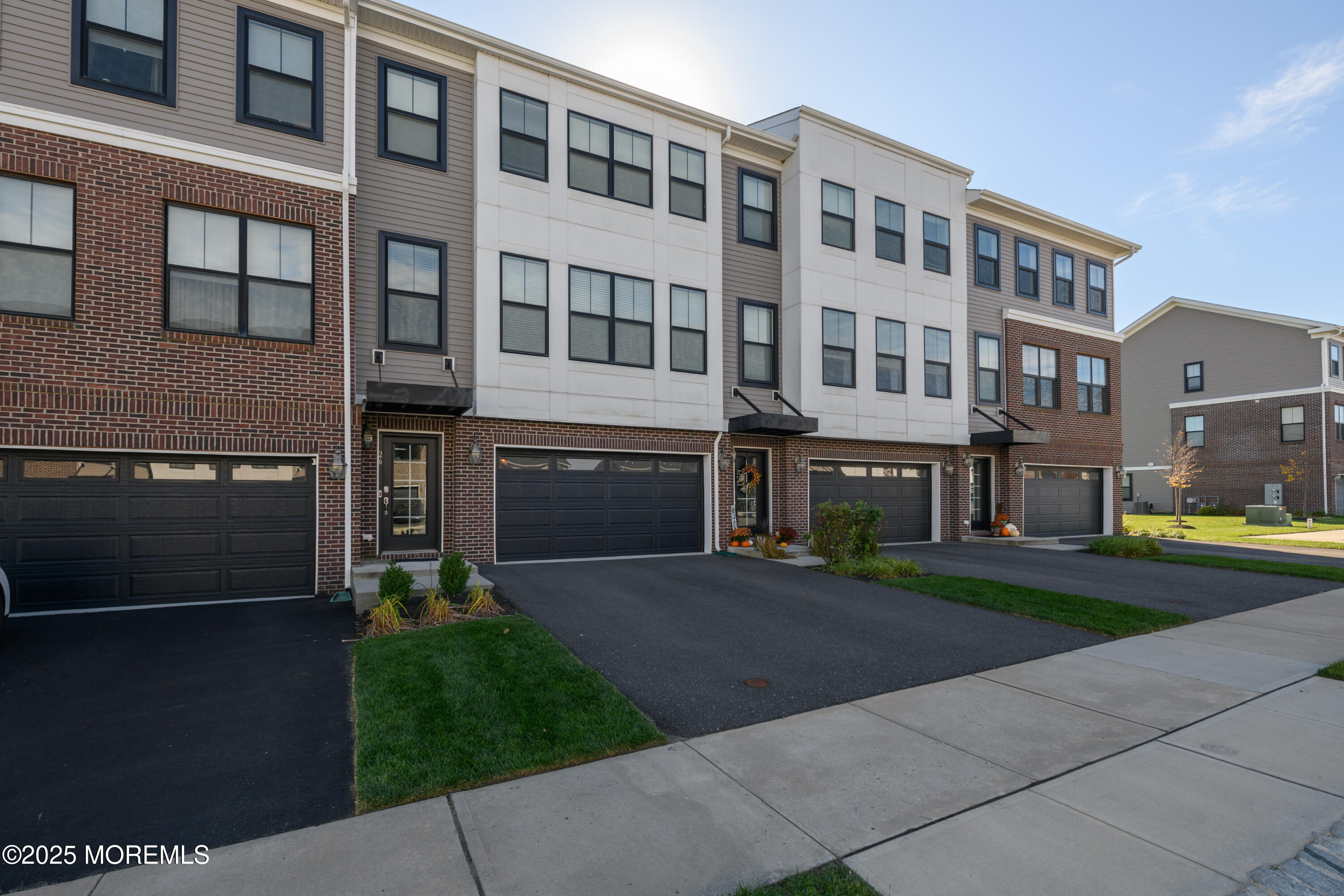 26 Kelly Way Tinton Falls, NJ 07724 - Photo 28 of 33 a front view of a building with a yard and trees