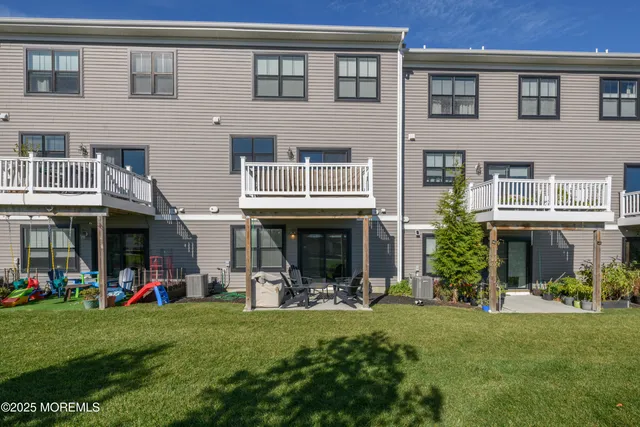 a view of a house with a yard and plants