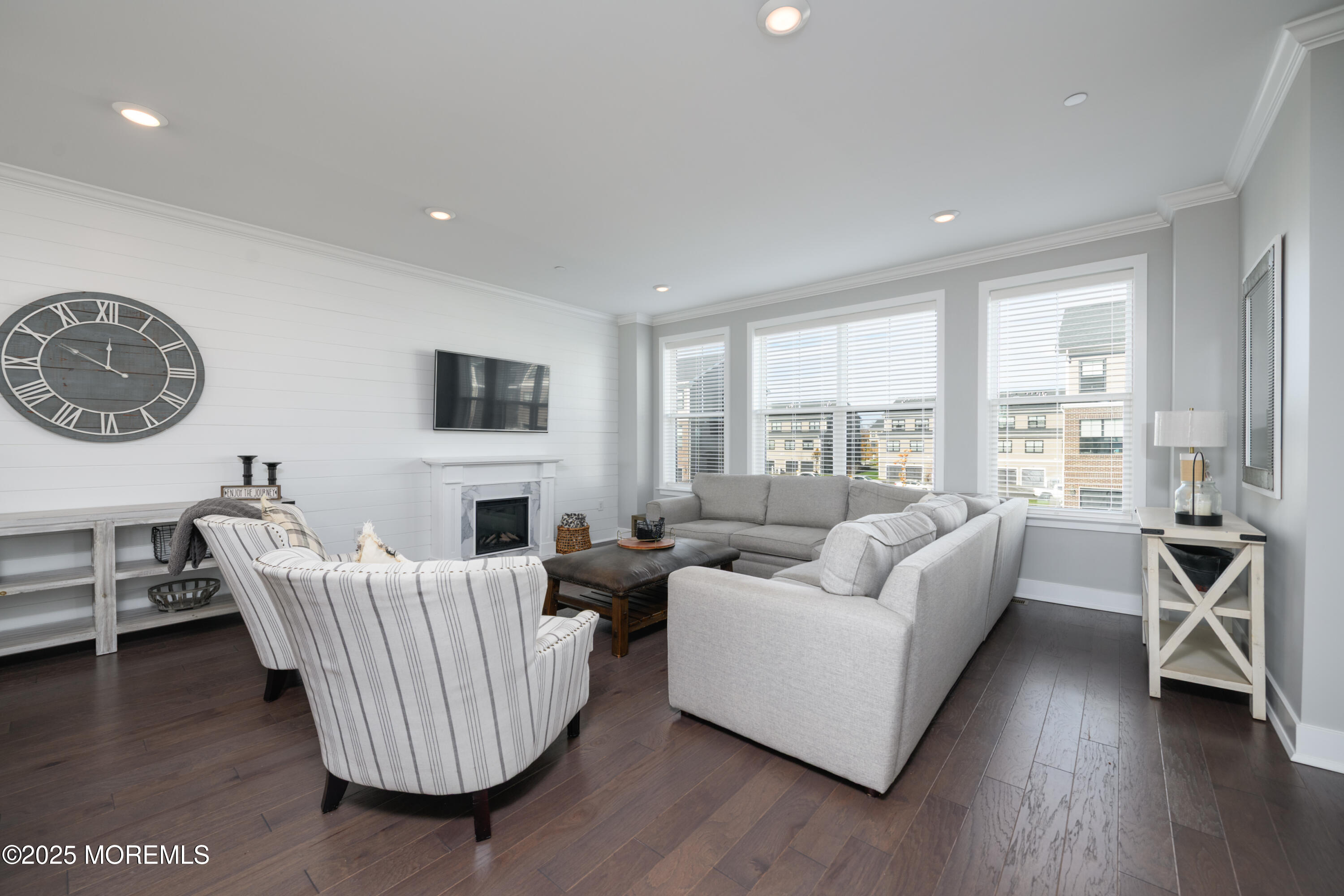 26 Kelly Way Tinton Falls, NJ 07724 - Photo 4 of 33 a living room with furniture a large window and a wooden floor