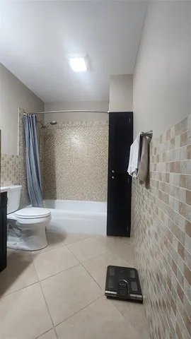 a bathroom with a sink and a shower