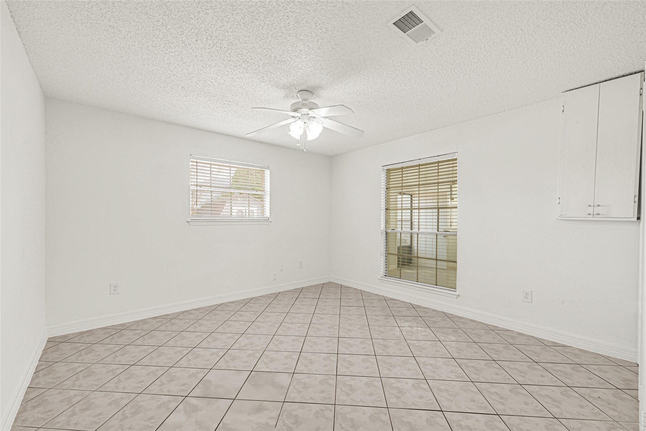 9208 Carousel Lane Houston, TX 77080 - Photo 12 of 31 a view of an empty room with a window